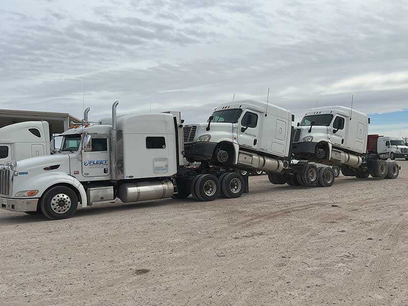 truck transporting trucks